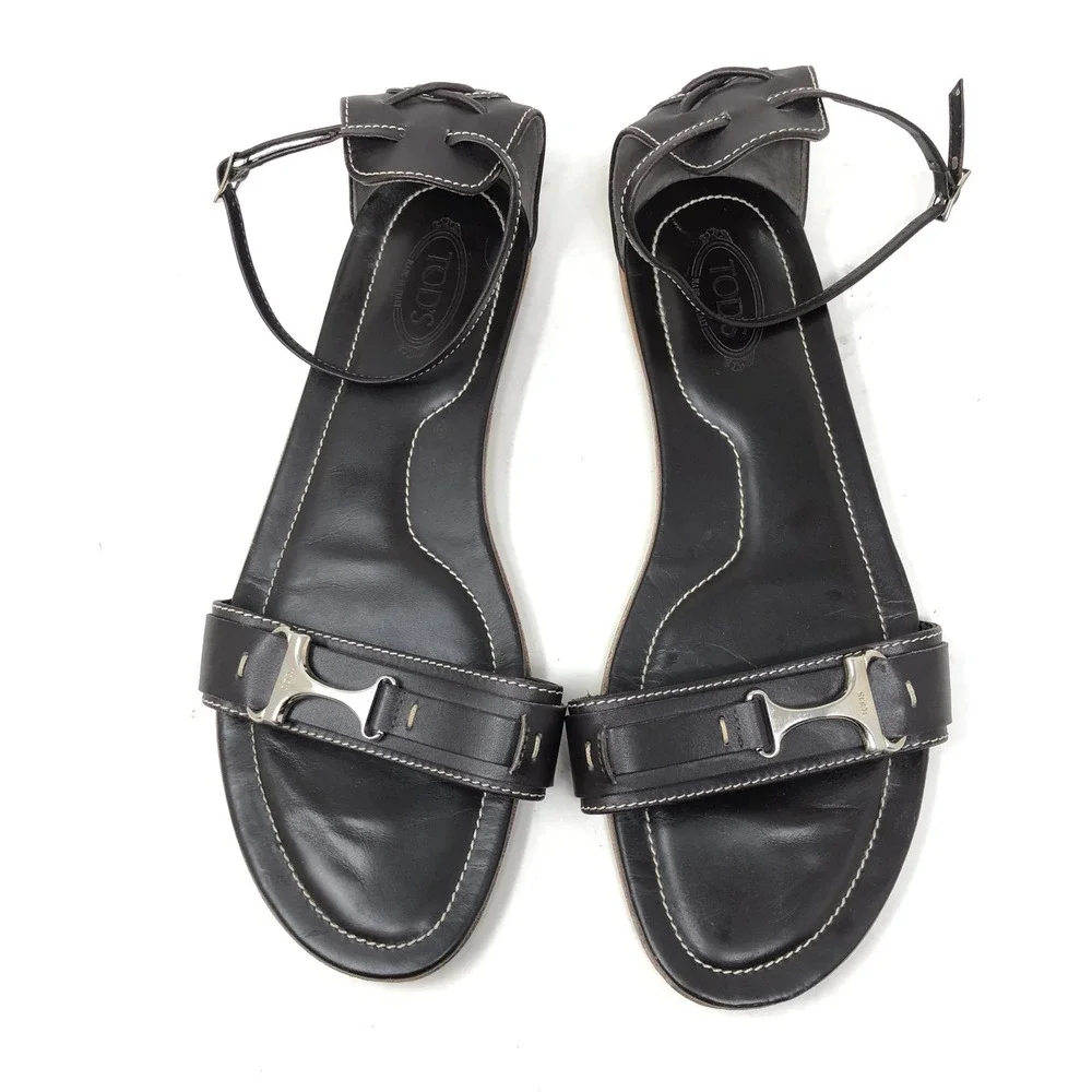 Tods Womens 38 Sandals Black Leather Ankle Strap Silver T-Bar Hardware Flat